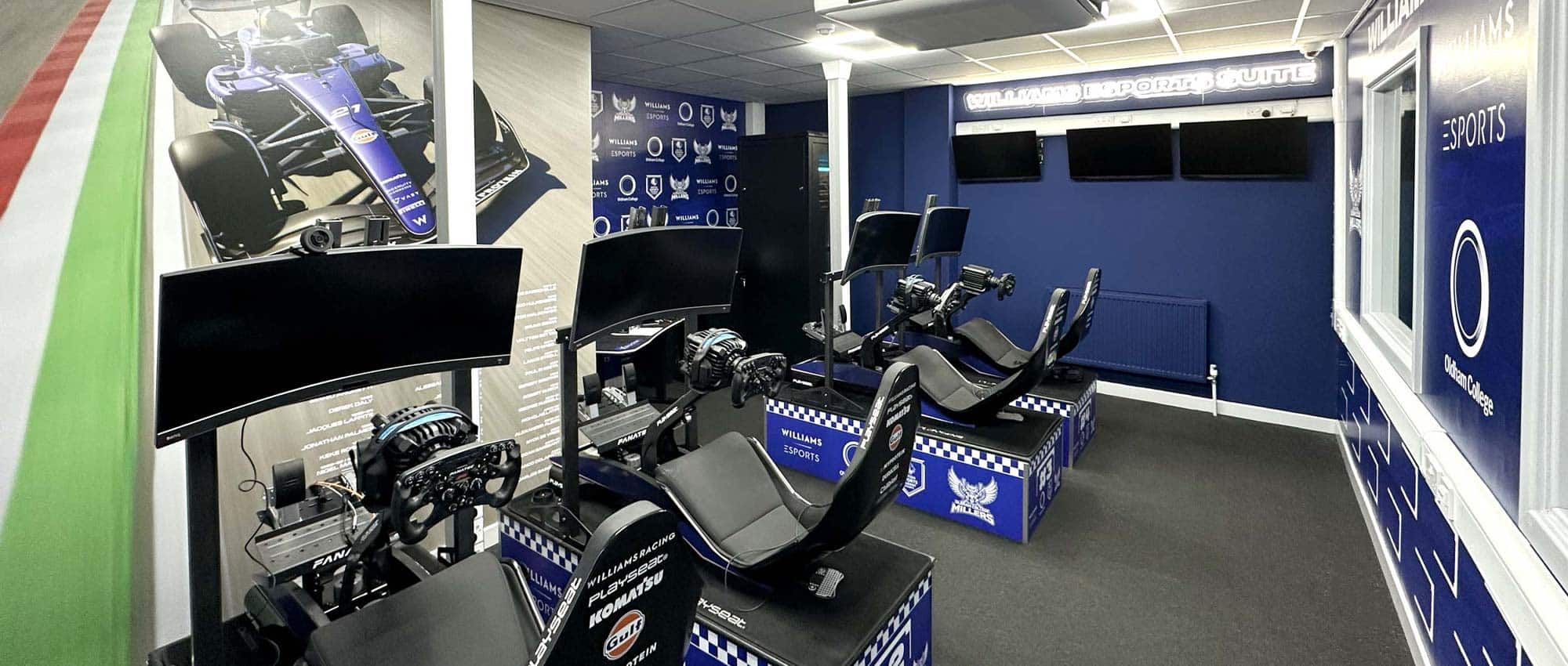 Large format vinyl and acrylic signs designed, printed, and installed for Williams Esports room at Sheffield United Football Club, featuring bold branding graphics and modern esports visuals.
