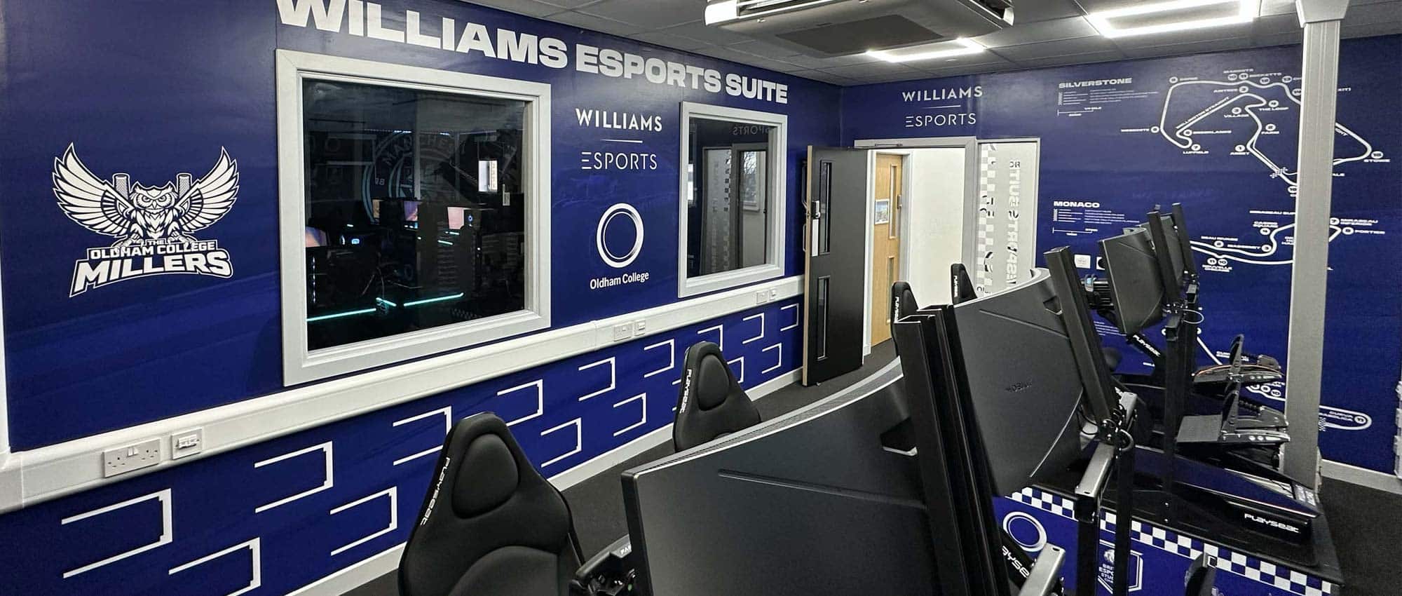 Large format vinyl and acrylic signs designed, printed, and installed for Williams Esports room at Sheffield United Football Club, featuring bold branding graphics and modern esports visuals.